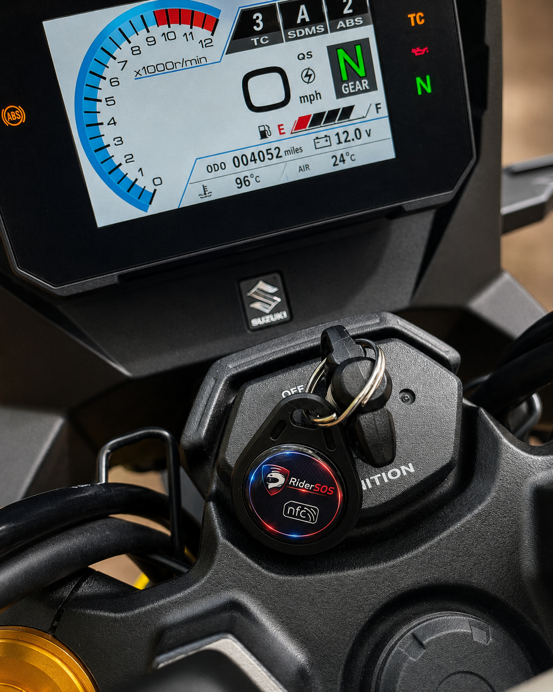 RiderSOS Key Tag attached to motorcycle ignition keys