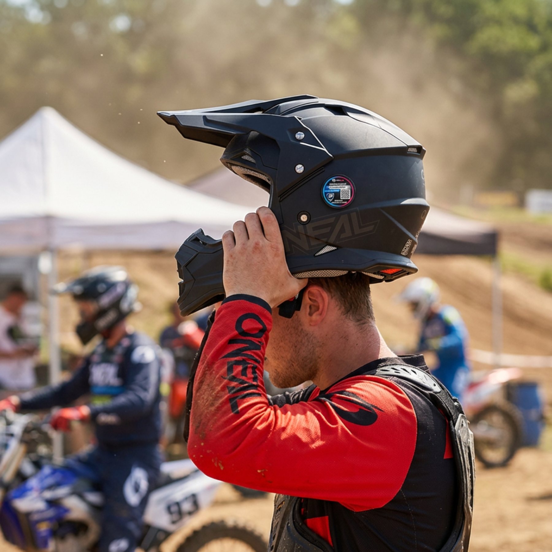 Rider wearing a RiderSOS Helmet Tag at a racetrack