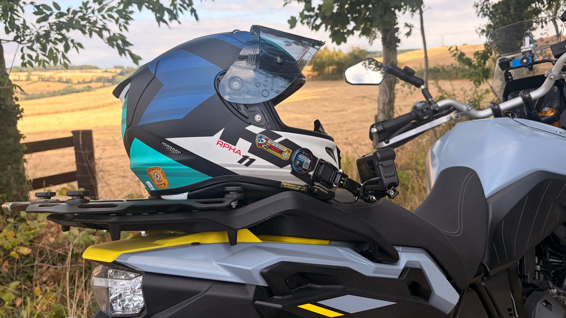 Motocross rider at the starting line wearing a helmet fitted with a RiderSOS emergency ID tag
